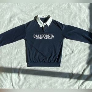 Long sleeved collared sweater